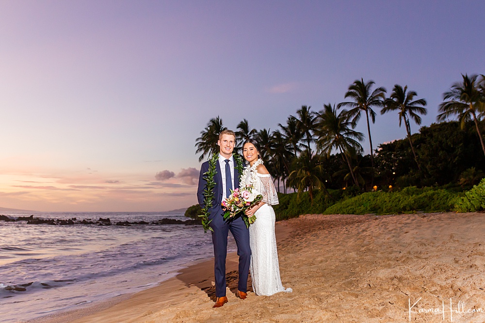 bride and groom on a sunset beach 