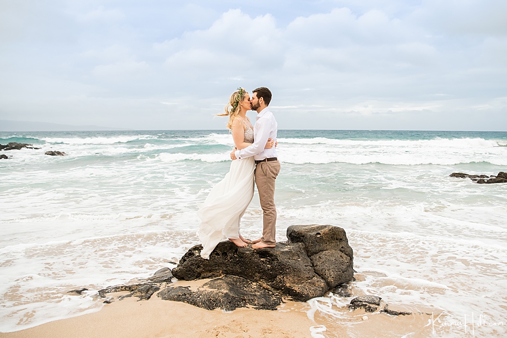 bride and groom - kissing by ocean - maui wedding 