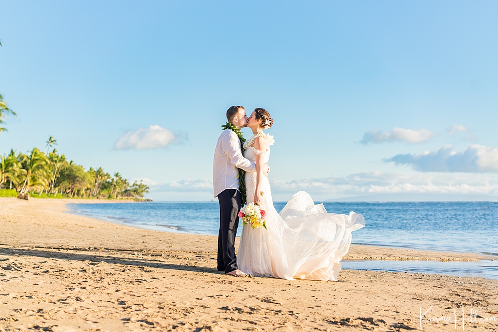Hawaii beach elopement - bride and groom - kissing - beautiful - maui - ocean 