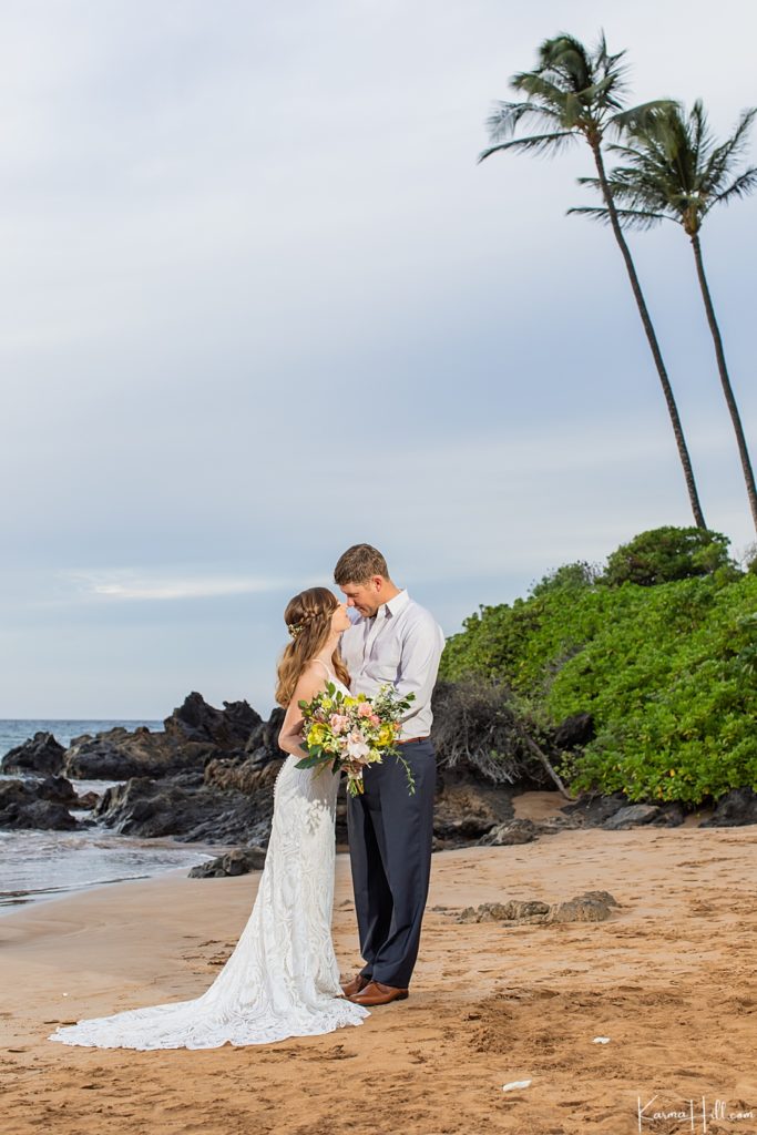 Hawaii wedding photographers - bride and groom on beach 
