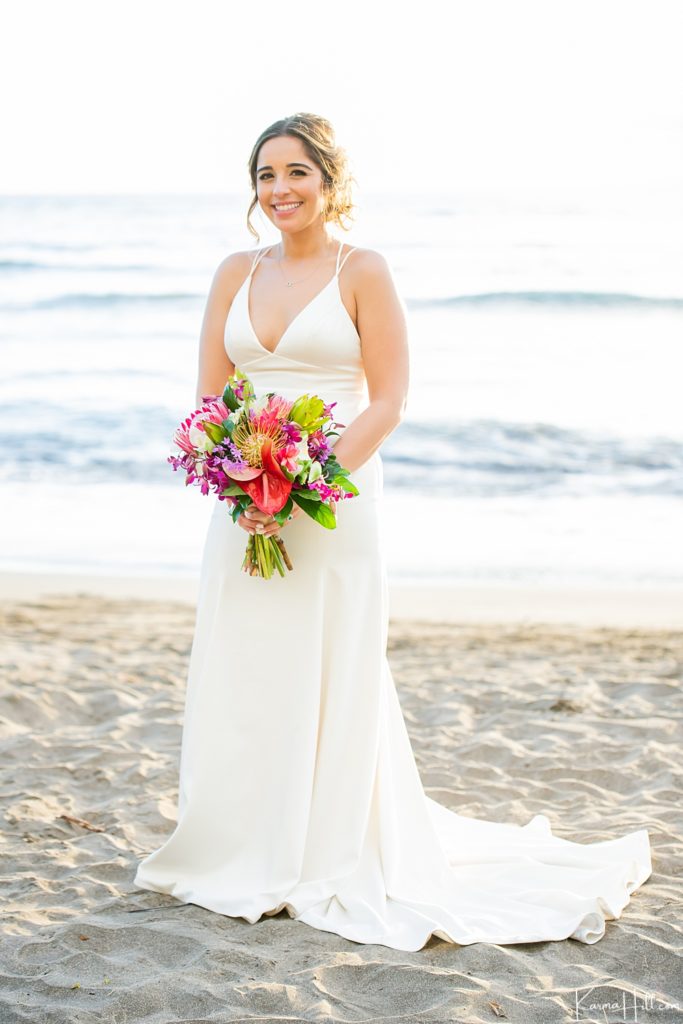 bride on beach with tropical bouquet 