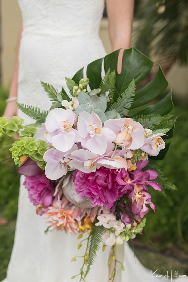 Rustic hawaiian beach wedding bouquet with orchids and monstera leaf