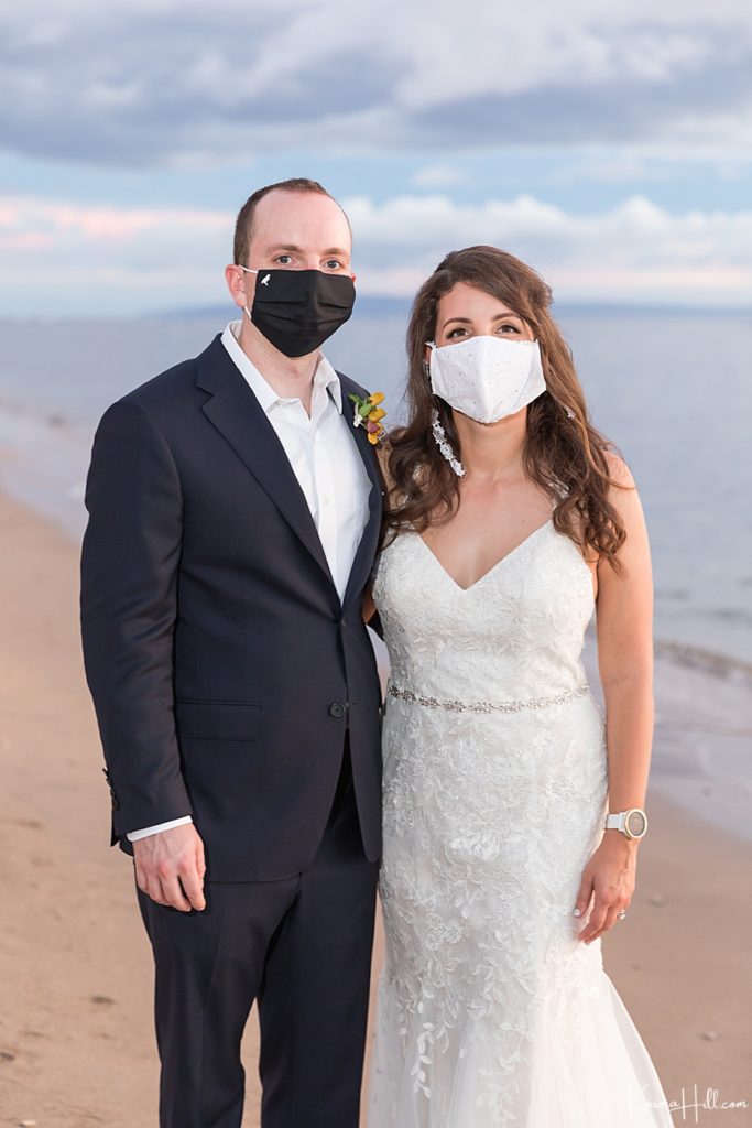 bride and groom wearing masks