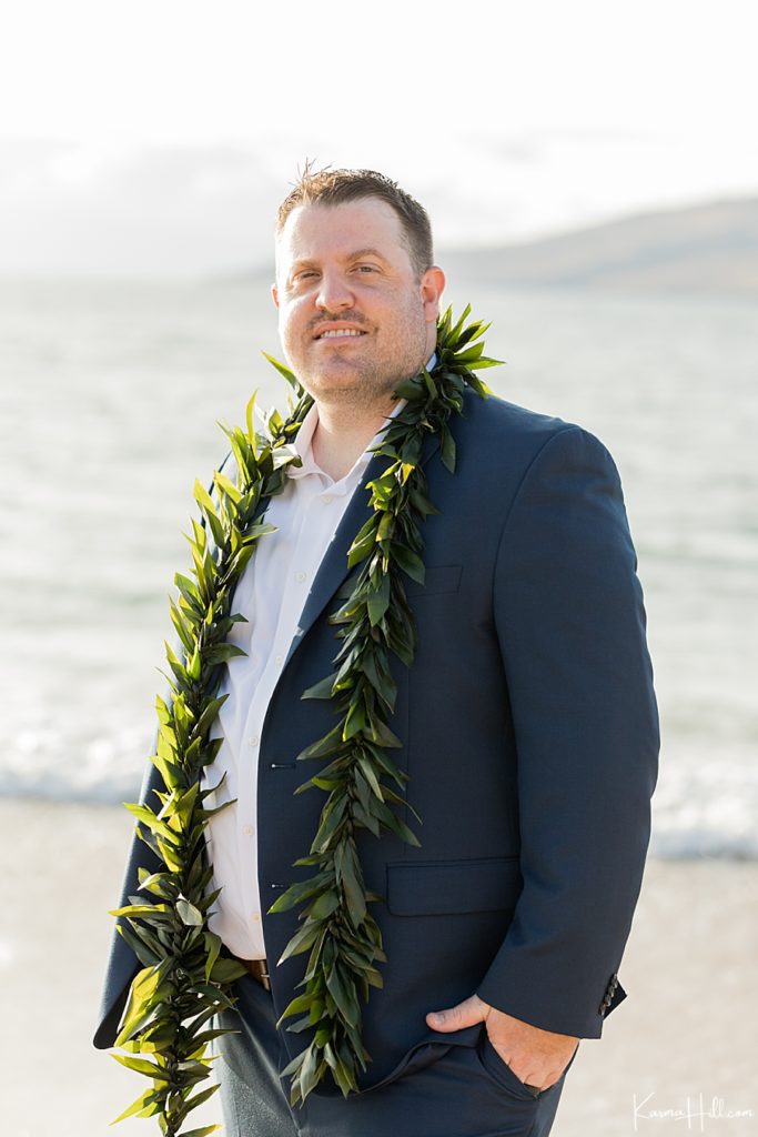 groom on beach in Maui