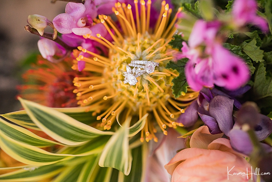 rings at the center of a hawaiian wedding bouquet 