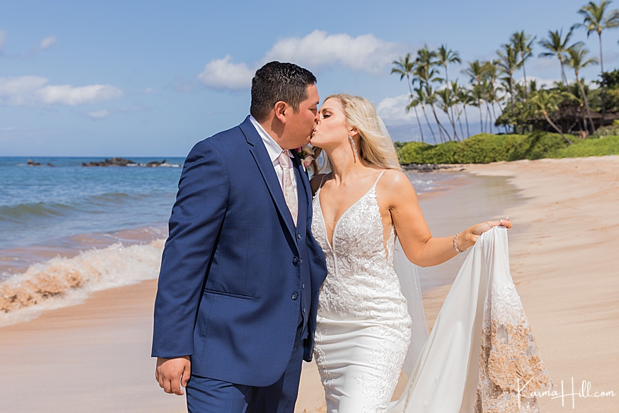 just married couple kiss on maui beach 
