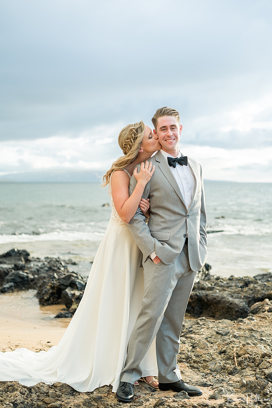 bride and groom on maui shore 