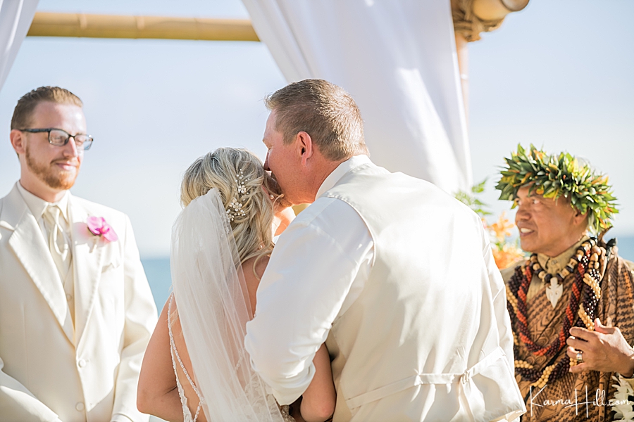 father of the bride kisses his daughter 