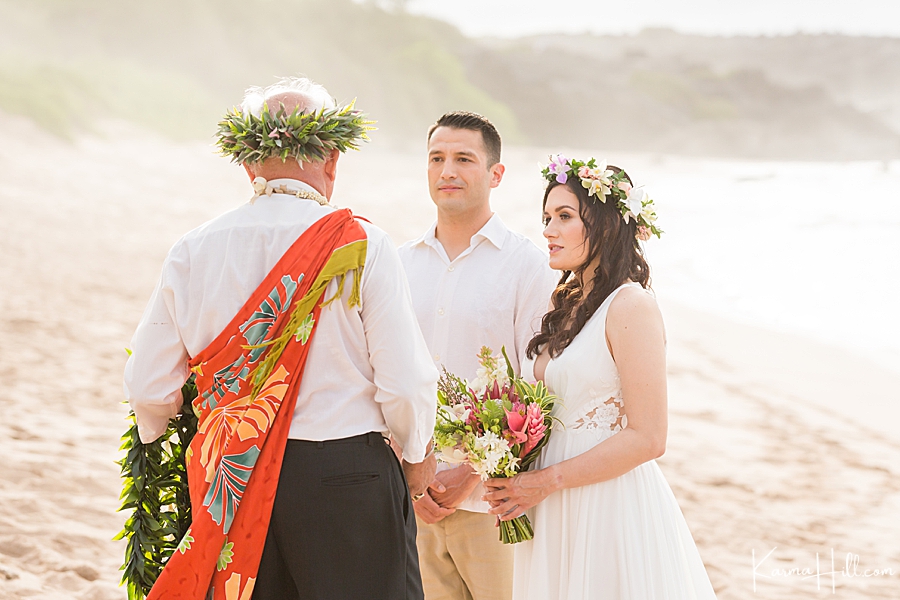 couple getting married with hawaiian minister on maui beach 