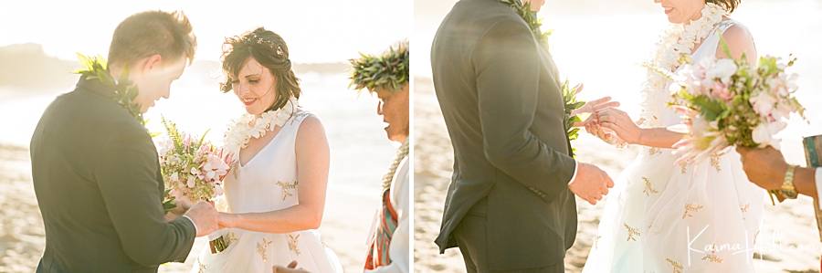 husband and wife exchange rings on their wedding day on a beach 