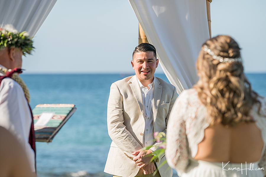 groom sees his bride for the first time at their 5 palms wedding in maui 