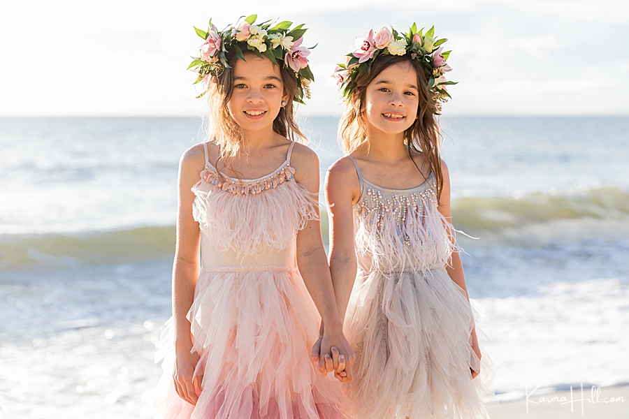 flower girl dress ideas for the beach - cute girls with flower crowns on the beach - fun and playful outfit ideas for kids in beach weddings 