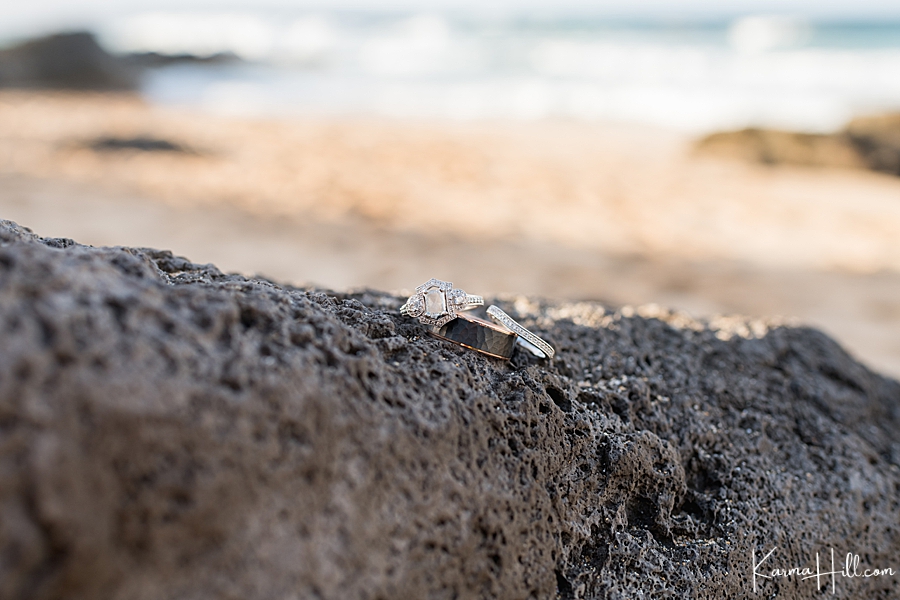 wedding rings posed on lava rocks 