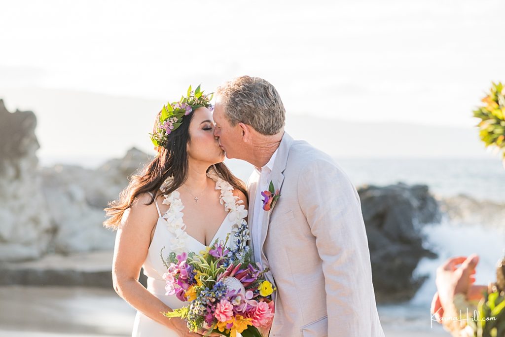 bride and groom share their first kiss as husband and wife 