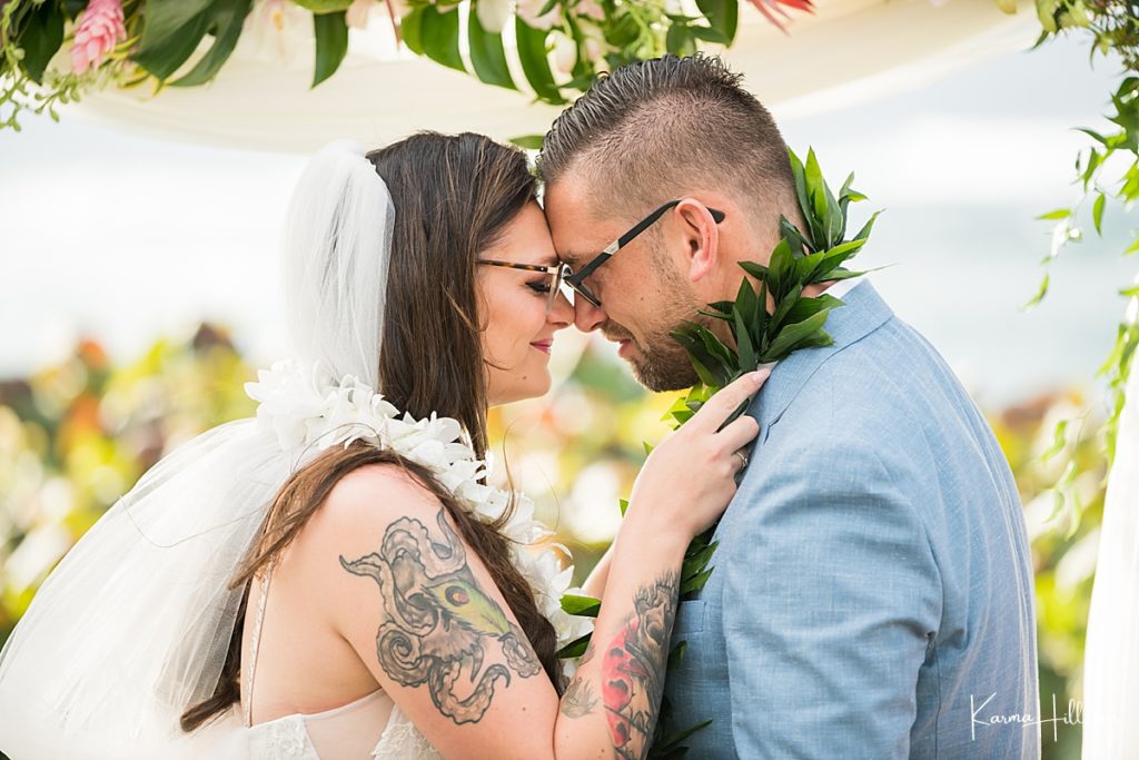 bride and groom touch foreheads during their Maui wedding 