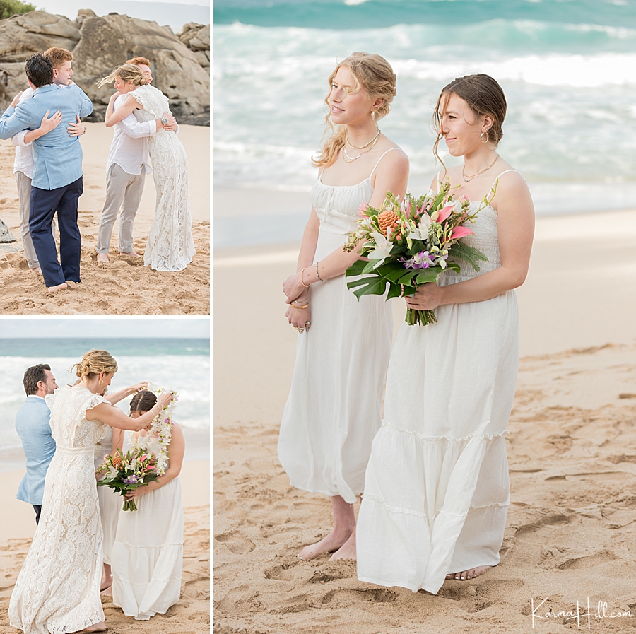 bride and groom give hugs and leis to their grown children during their maui beach wedding 