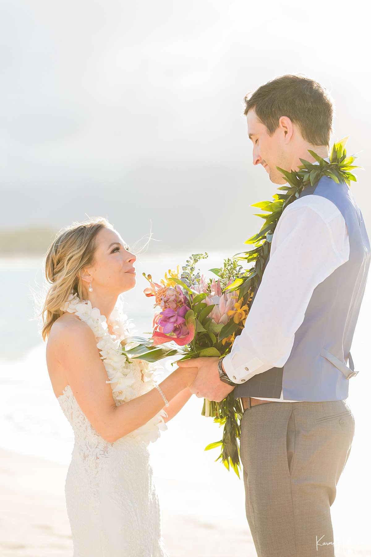 bride and groom on the shore of baldwin beach in maui 