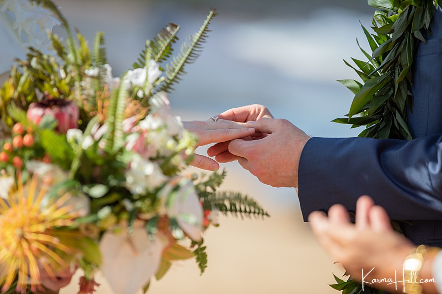 close up of ring exchange during hawaii wedding 