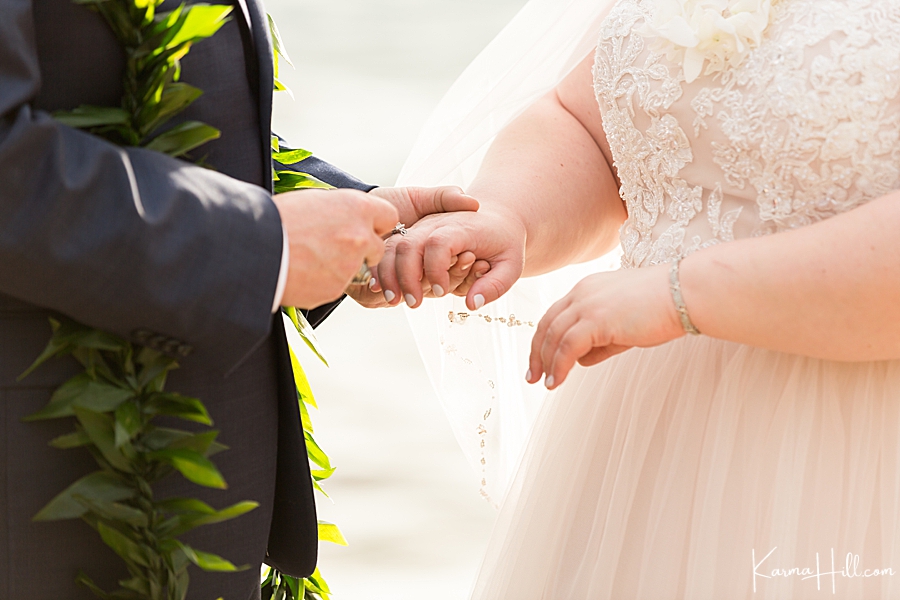 bride and groom exchange rings 