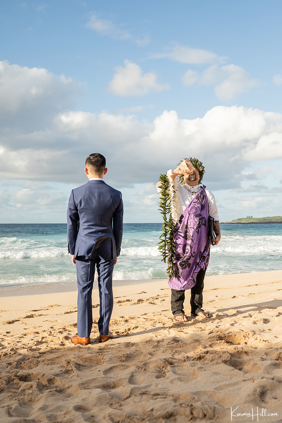 groom waits for his bride with his back turned during their maui beach wedding 