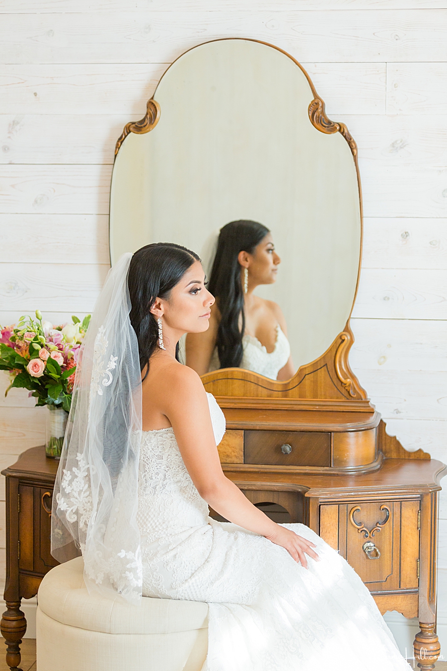 bride getting ready profile shot with mirrored reflection 