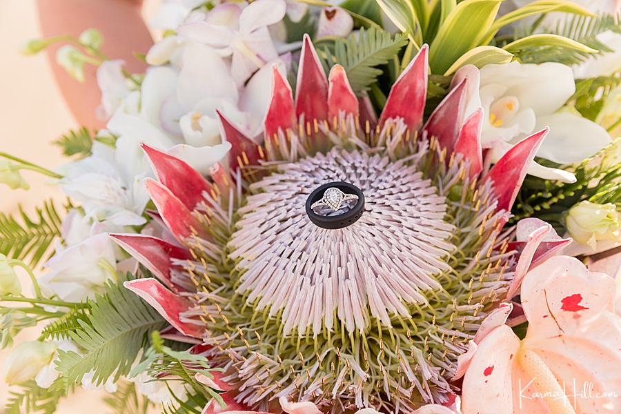 protea hawaiian wedding bouquet with rings at the center 
