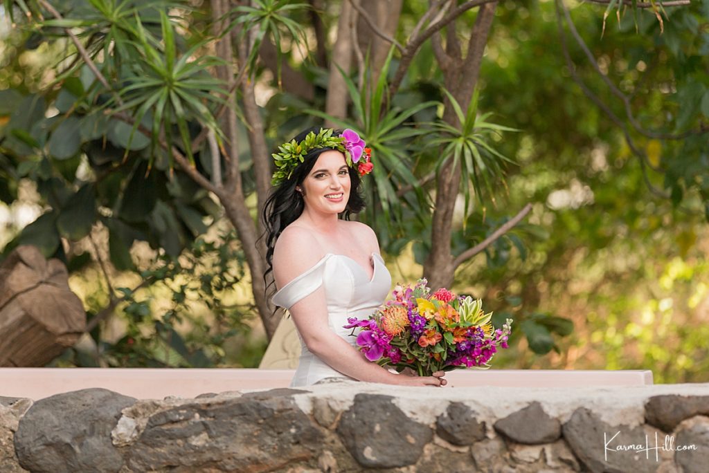 stunning Maui bride at the trinity by the sea church in kihei wearing a flower crown and satin dress 