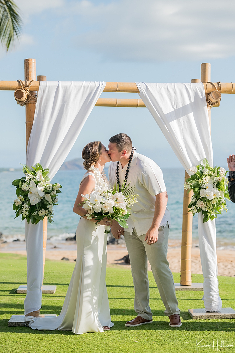 first kiss between bride and groom during wedding in hawaii 