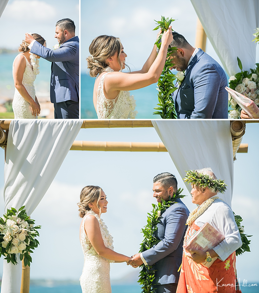 wedding at the five palms in hawaii lei exchange between bride and groom 