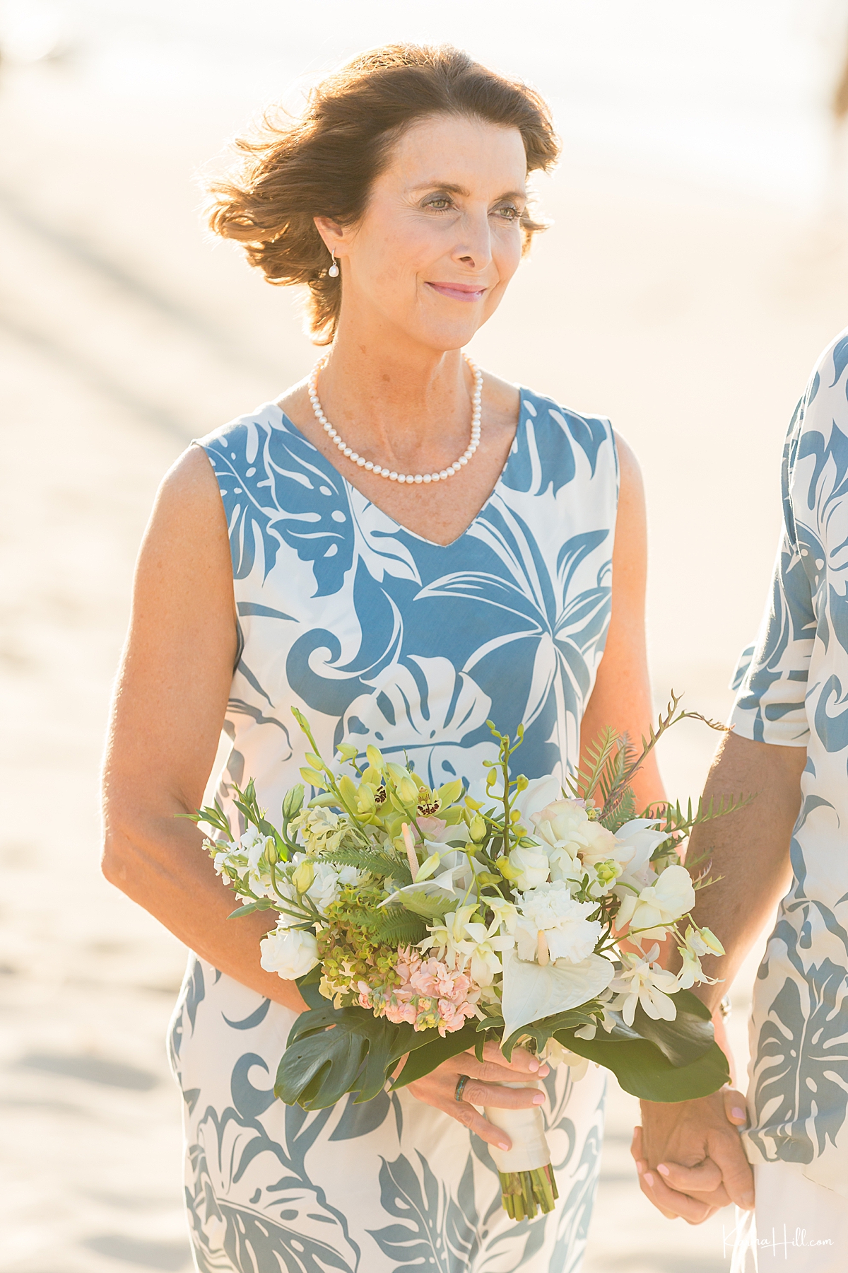 older bride wearing beach aloha prints 
