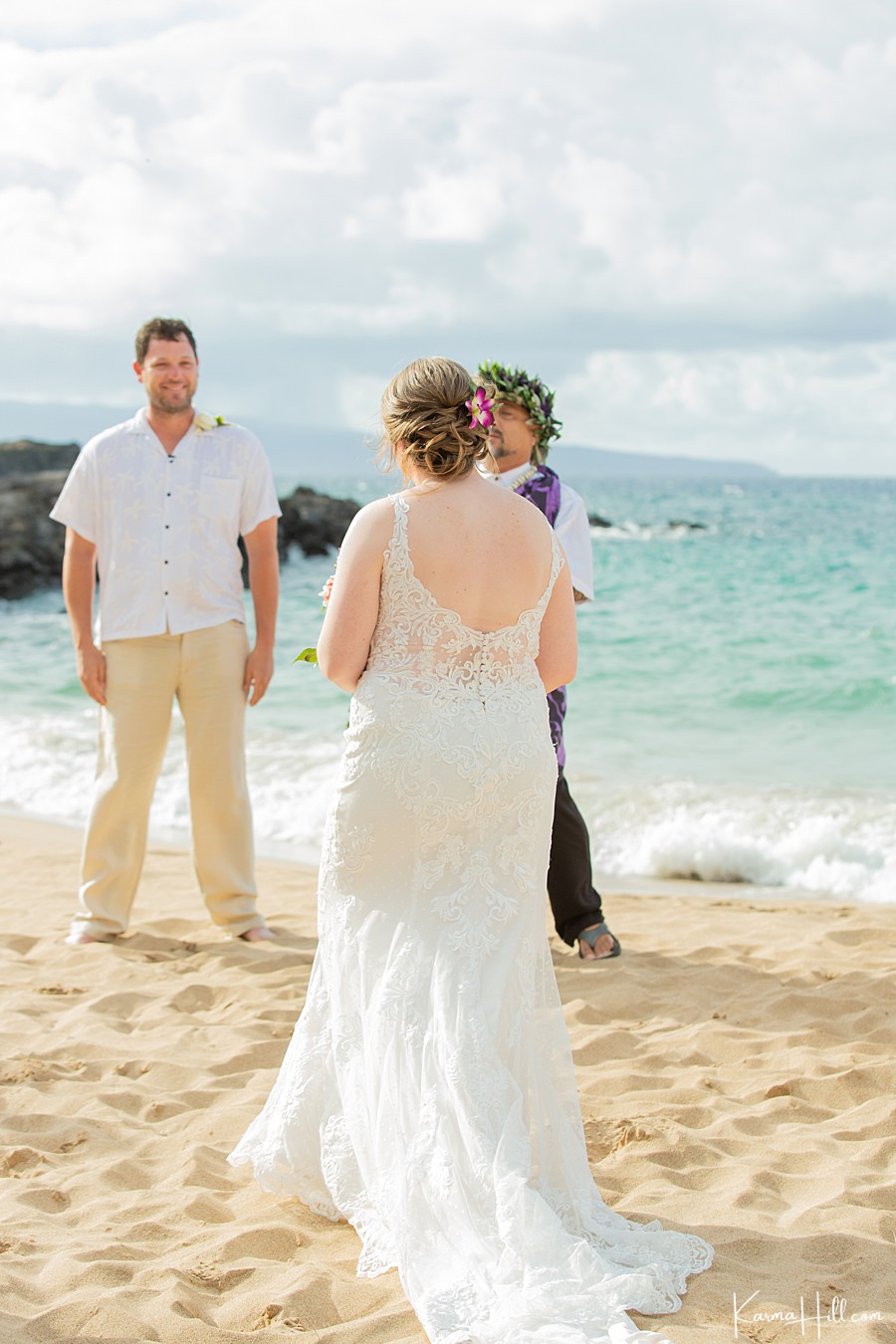 groom sees bride for the first time during beach wedding 