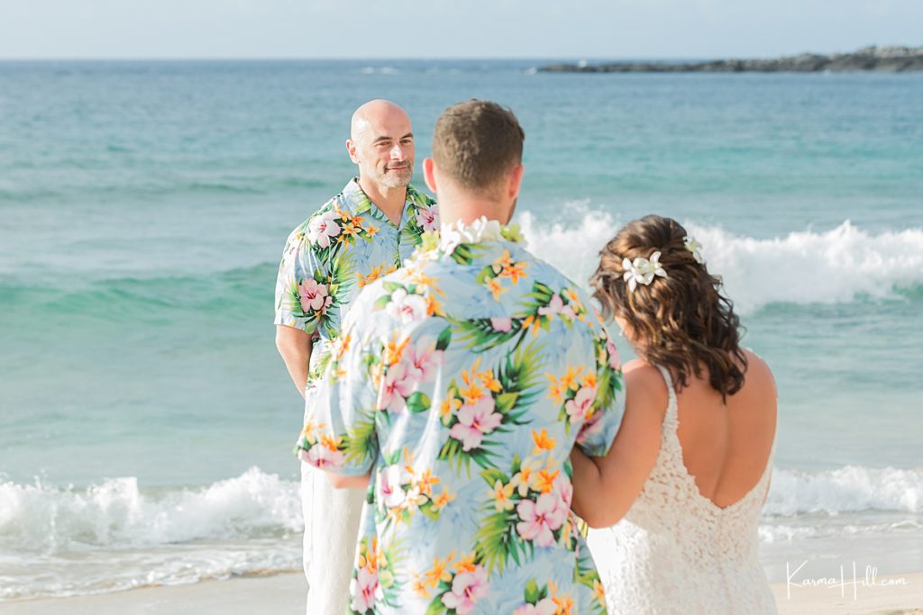 groom looks at his bride with love during maui wedding 