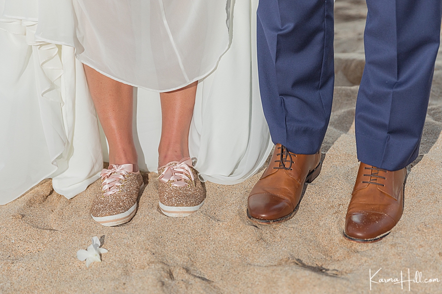 cute photo of bride and groom shoes on the sand 