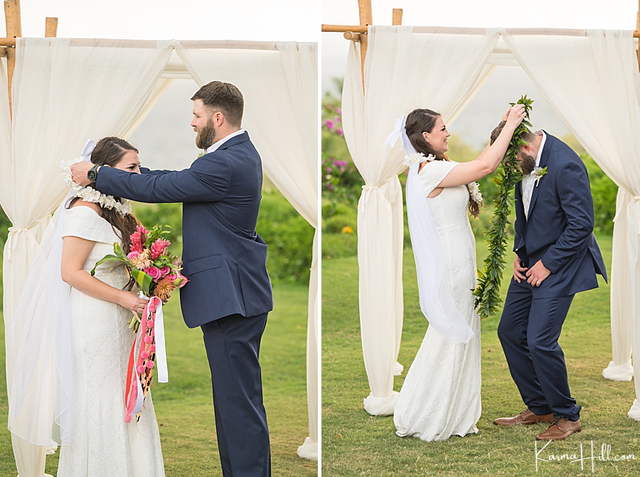 bride and groom exchange leis at wedding