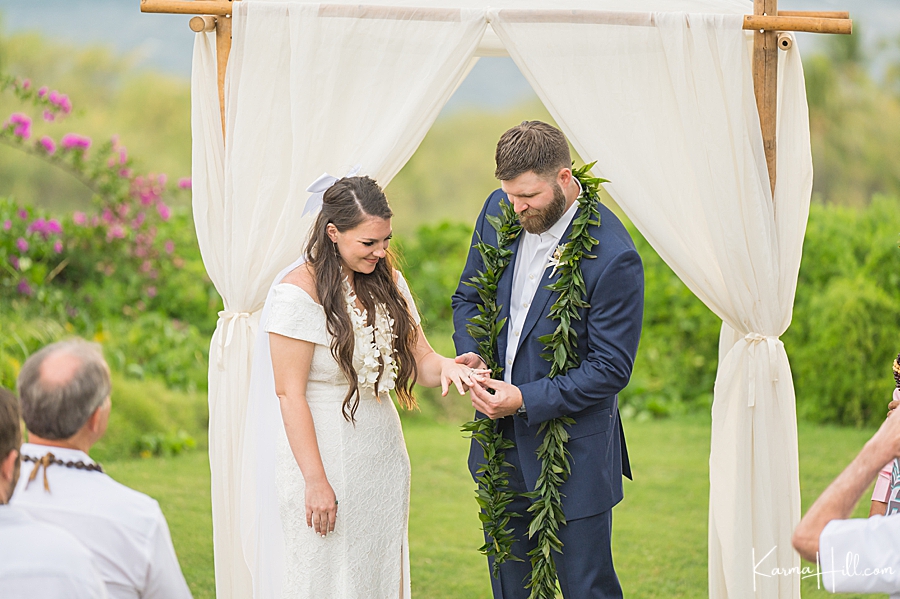 groom gives bride the ring