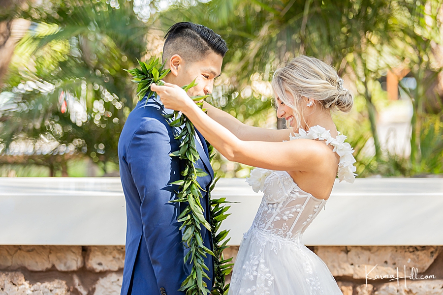 bride exchanging lei with groom