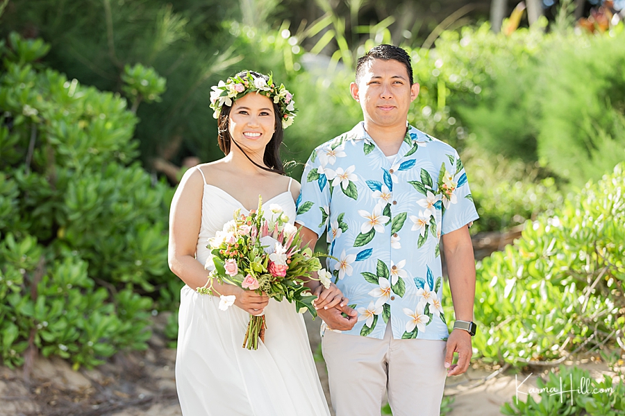 bride and groom walking down the aisle at beach wedding