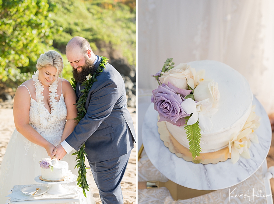 bride and groom cut cake at maui beach wedding
