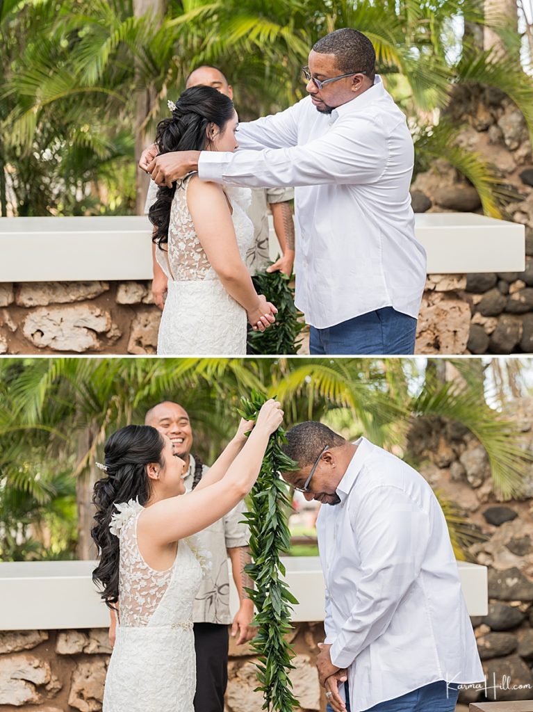 bride and groom exchange leis at wedding ceremony