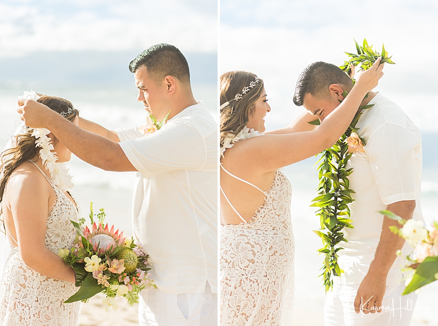 bride and groom exchanging lei at hawaii wedding