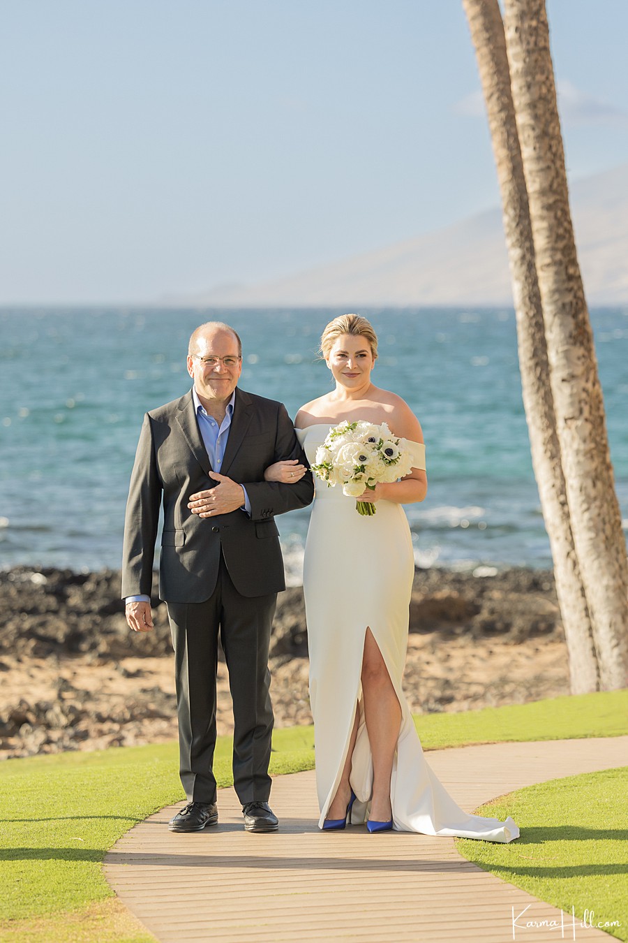 bride walking down the aisle with father at five palms maui