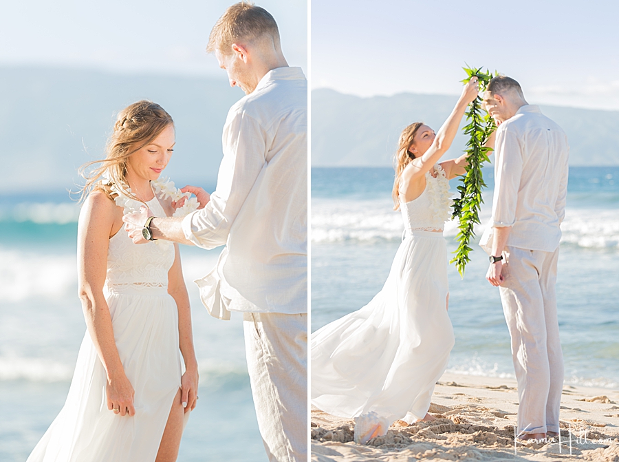 bride and groom exchanging leis at hawaii wedding