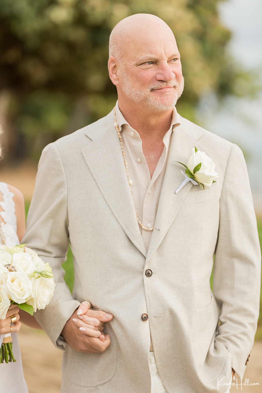 groom looks for hawaii beach wedding