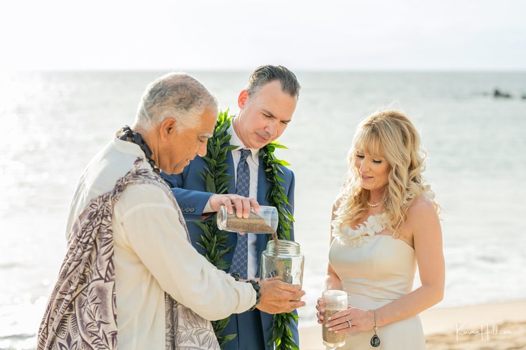 bride and groom doing sand ceremony in wedding