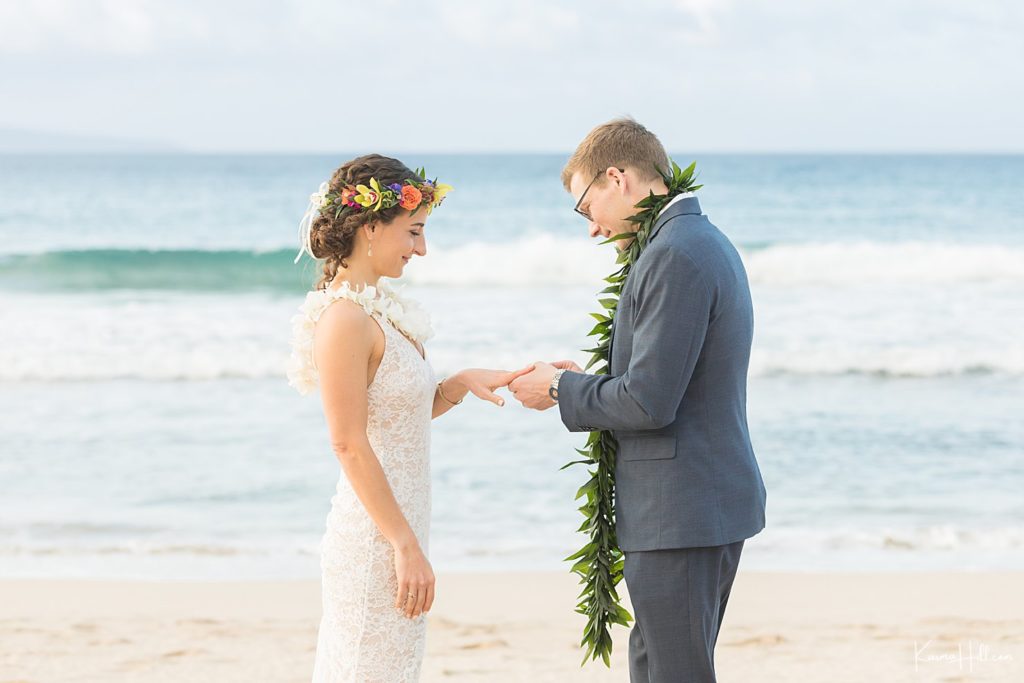 groom exchanging ring with bride at hawaii wedding