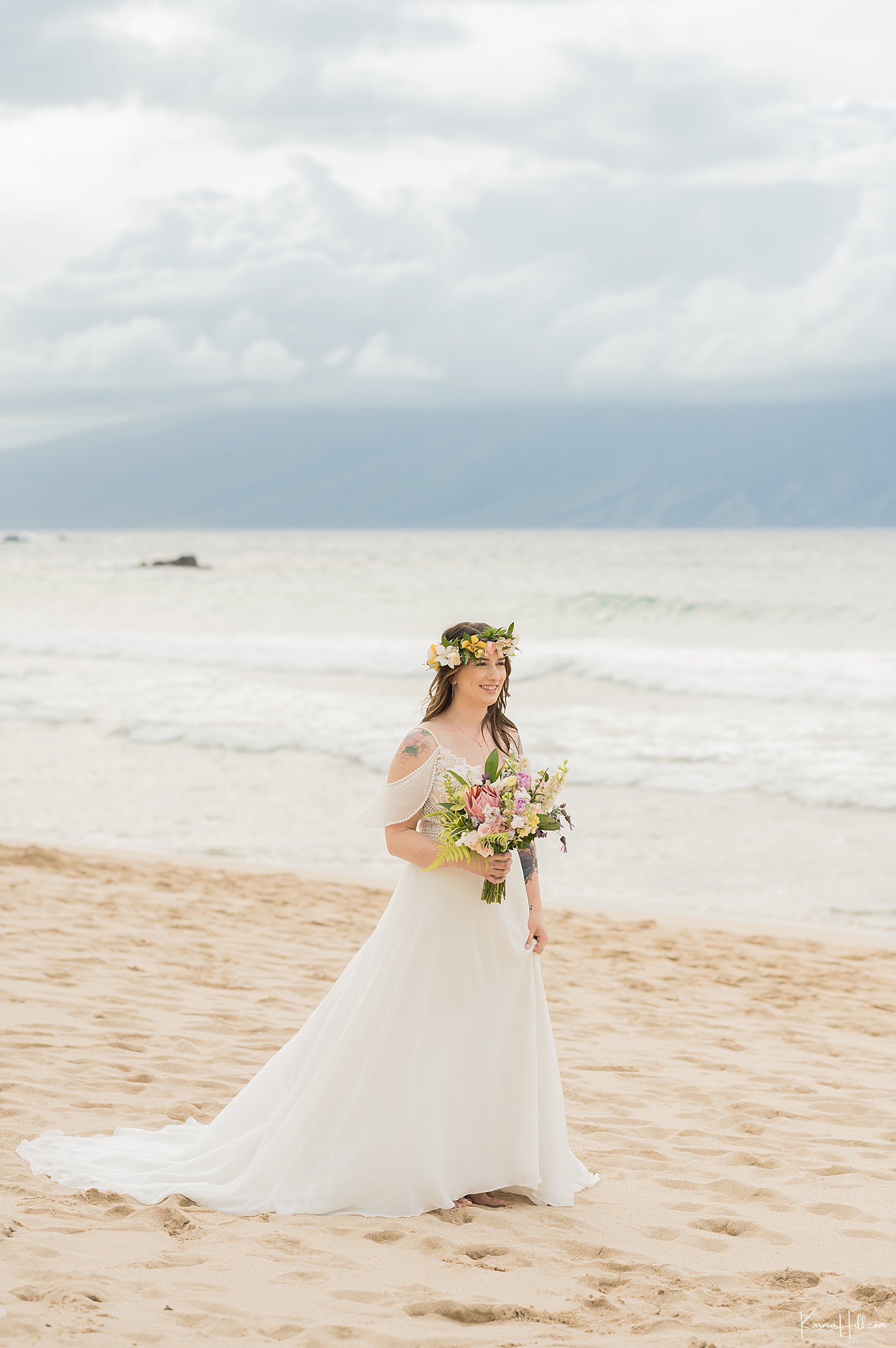 bride walking down aisle at ironwoods beach wedding
