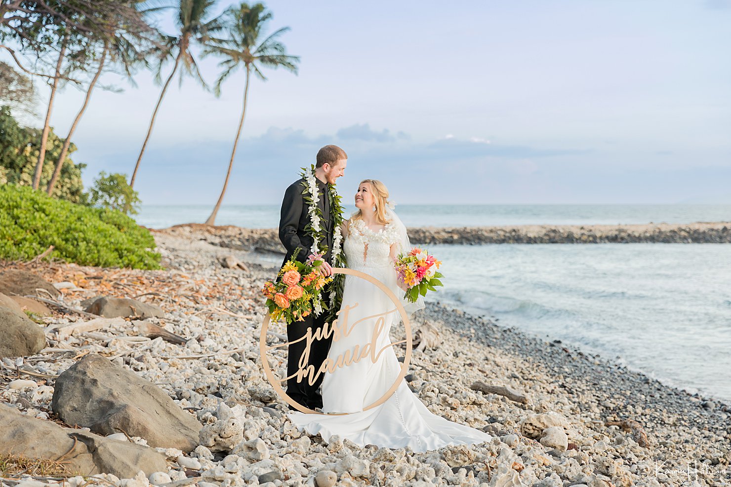 newlyweds on beach in maui