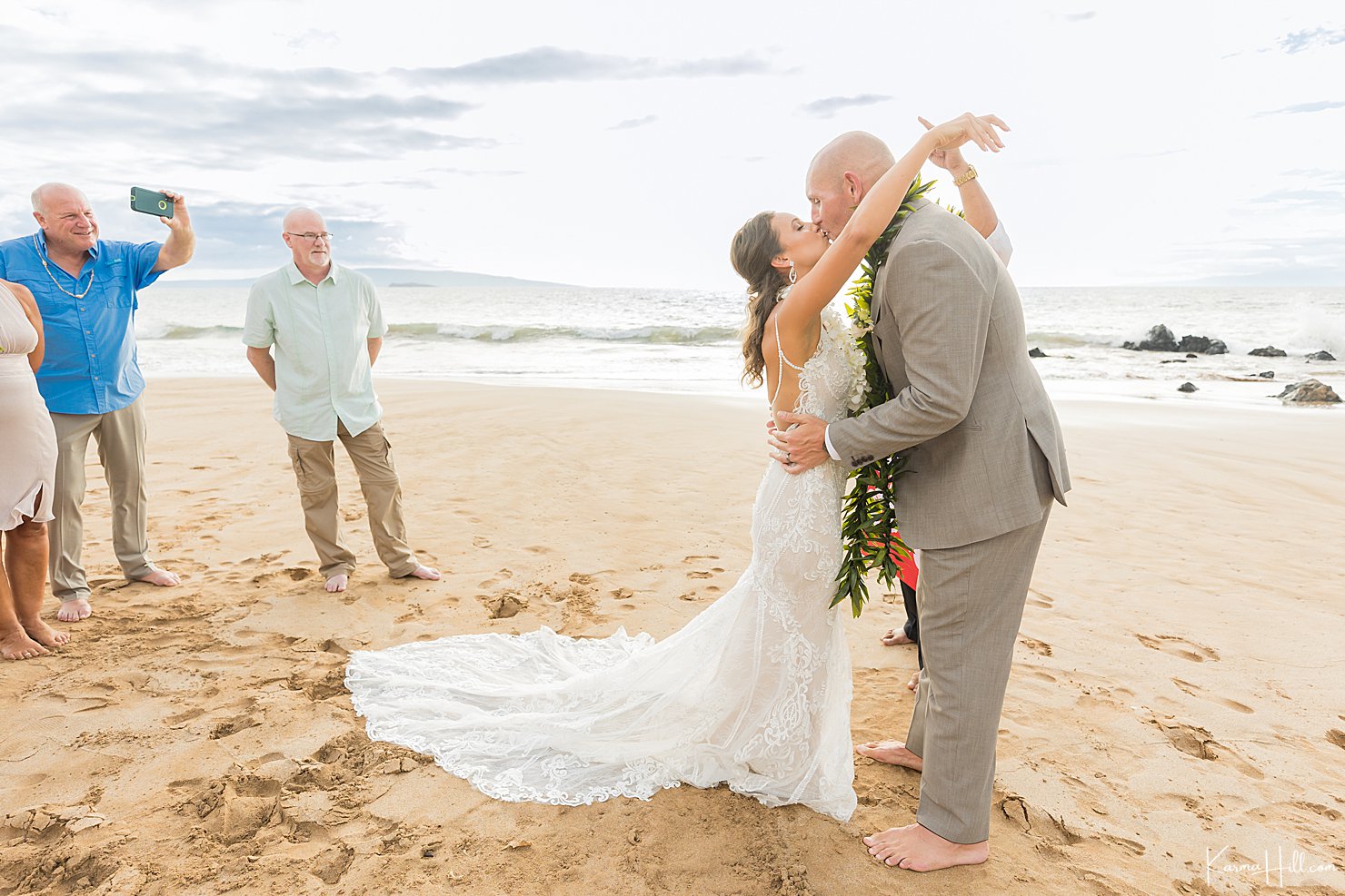 bride and groom kiss wedding in maui