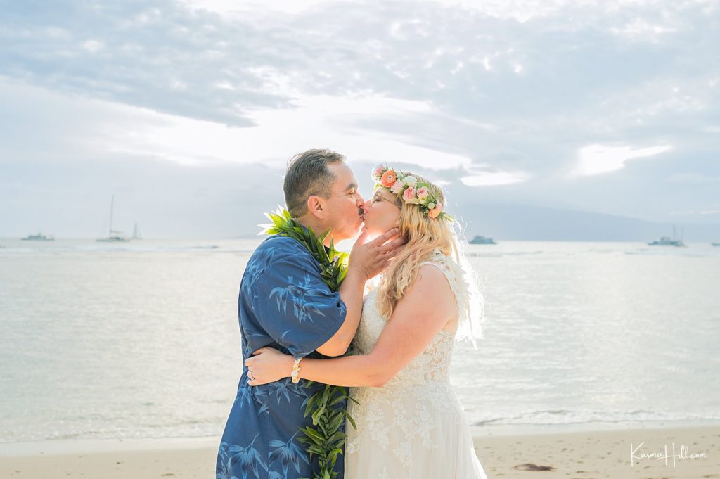 bride and groom kiss in maui