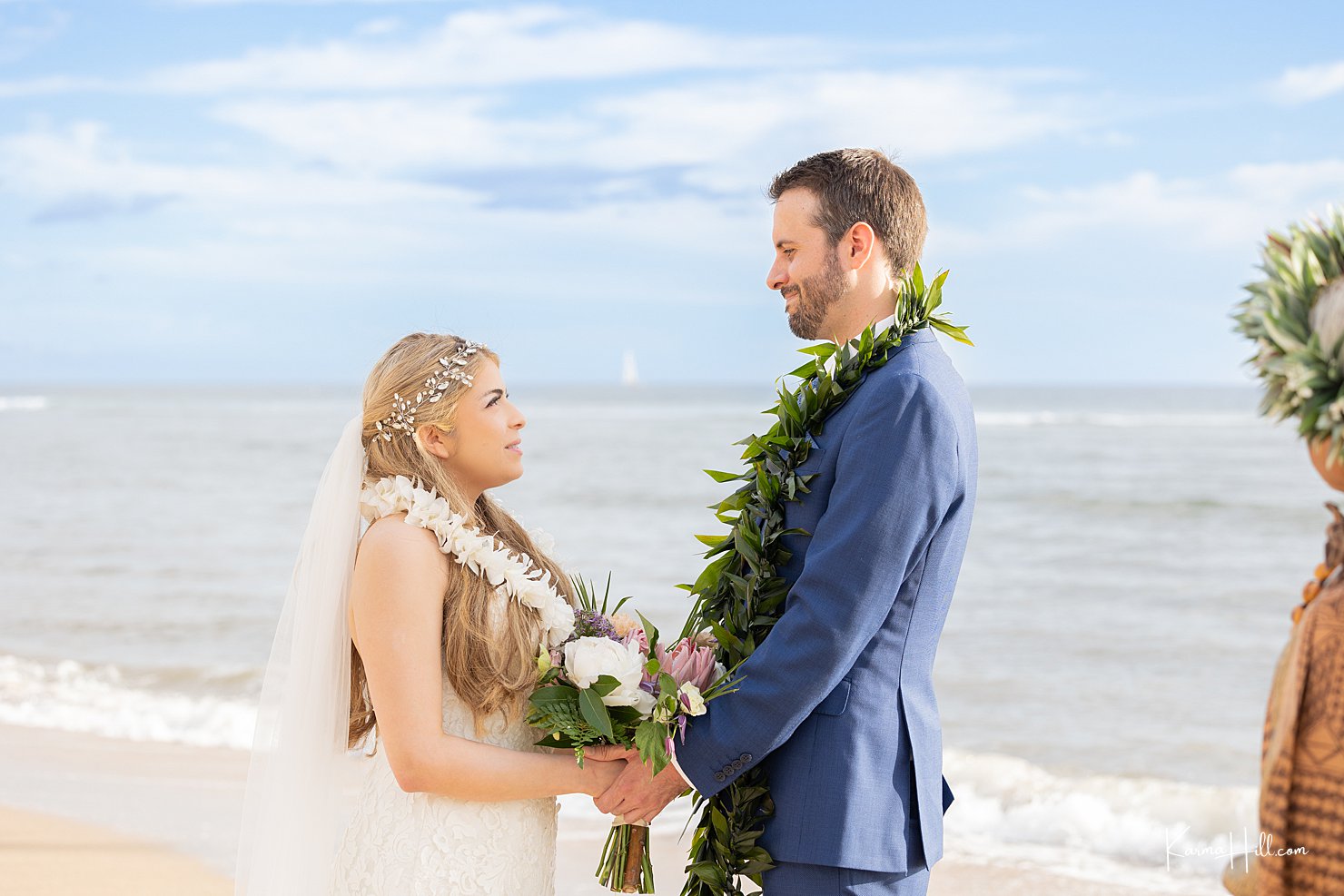 Maui Beach Wedding couple at their ceremony exchanging vows